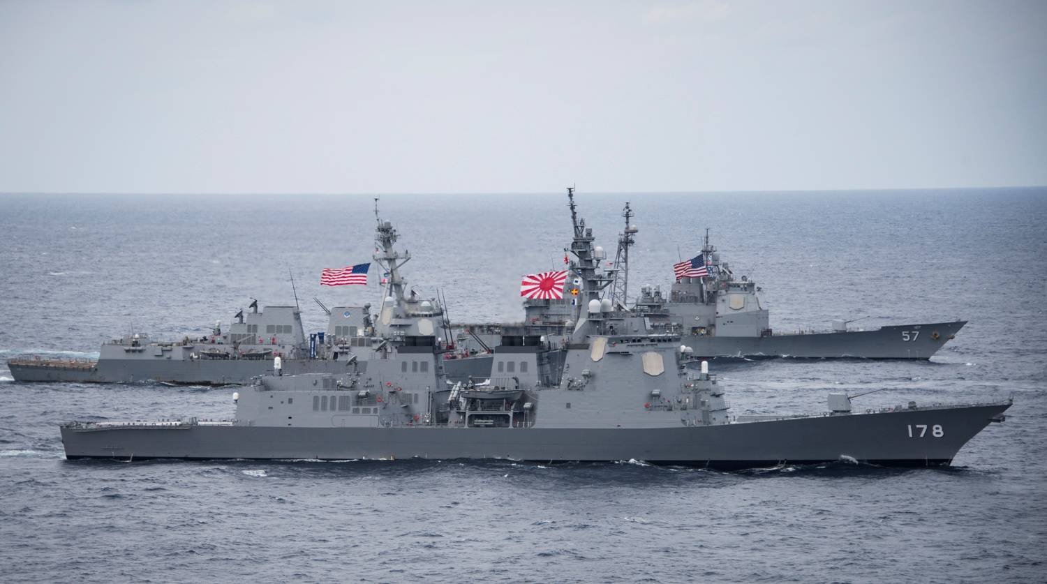 A Maritime Self-Defense Force destroyer and two U.S. Navy guided-missile destroyers transit the Philippine Sea in April 2017.  | U.S. NAVY / VIA REUTERS 