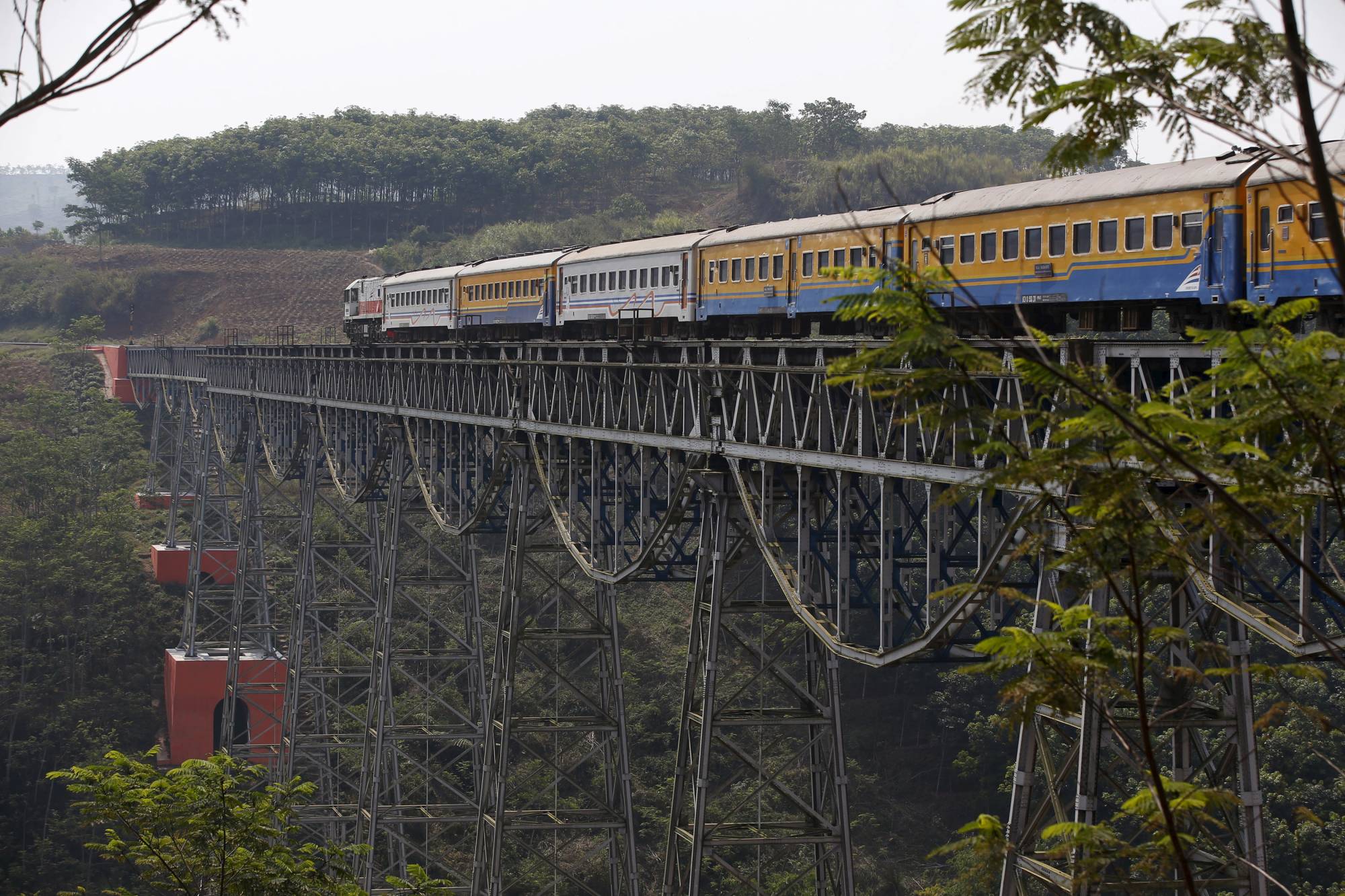 A passenger train travels from the city of Bandung to Jakarta in West Java, Indonesia. Tokyo is by far the largest investor in Southeast Asian infrastructure. | REUTERS