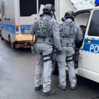 German special police forces patrol and search the area in Bad Lobenstein, Thuringia, eastern Germany, on Dec. 7, as part of nationwide early morning raids against members of a far-right group suspected of planning an attack on parliament. | FRICKE / NEWS5 / VIA AFP-JIJI