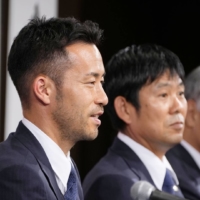 Japan captain Maya Yoshida (second from left) and head coach Hajime Moriyasu (second from right) speak to reporters following the team\'s return from the 2022 FIFA World Cup in Qatar.  | KYODO