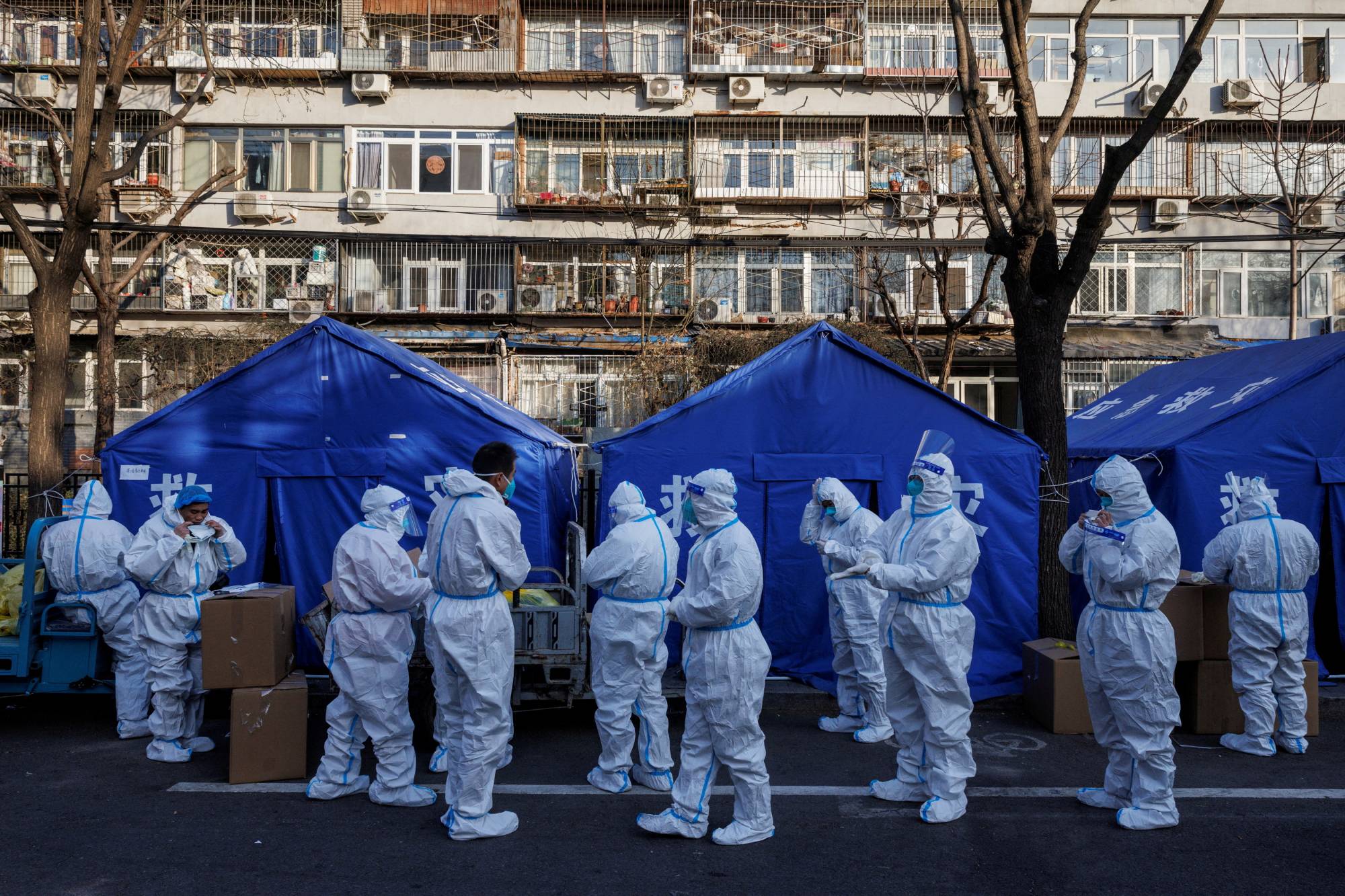 Pandemic prevention workers in Beijing on Thursday | REUTERS