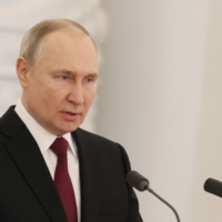 Russian President Vladimir Putin delivers a speech on the eve of Heroes of the Fatherland Day at the Kremlin in Moscow on Thursday. | POOL / SPUTNIK / VIA REUTERS 