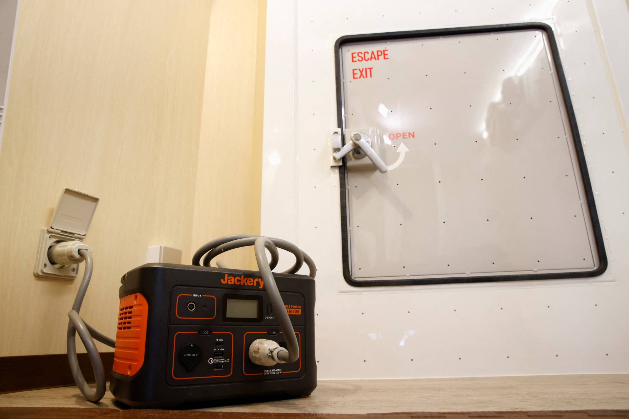 A portable battery unit and escape door in Morohoshi's shelter | Reuters