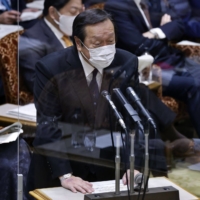 Defense Minister Yasukazu Hamada speaks during a budget committee session at the Upper House of parliament in Tokyo on Dec. 1. | BLOOMBERG