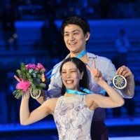 Japan\'s Riku Miura and Ryuichi Kihara celebrate after winning gold at the Grand Prix Final in Turin, Italy, on Friday.  | AFP-JIJI