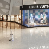 An automated disinfecting robot roams through a luxury shopping mall in Shanghai on Thursday.  | QILAI SHEN / THE NEW YORK TIMES