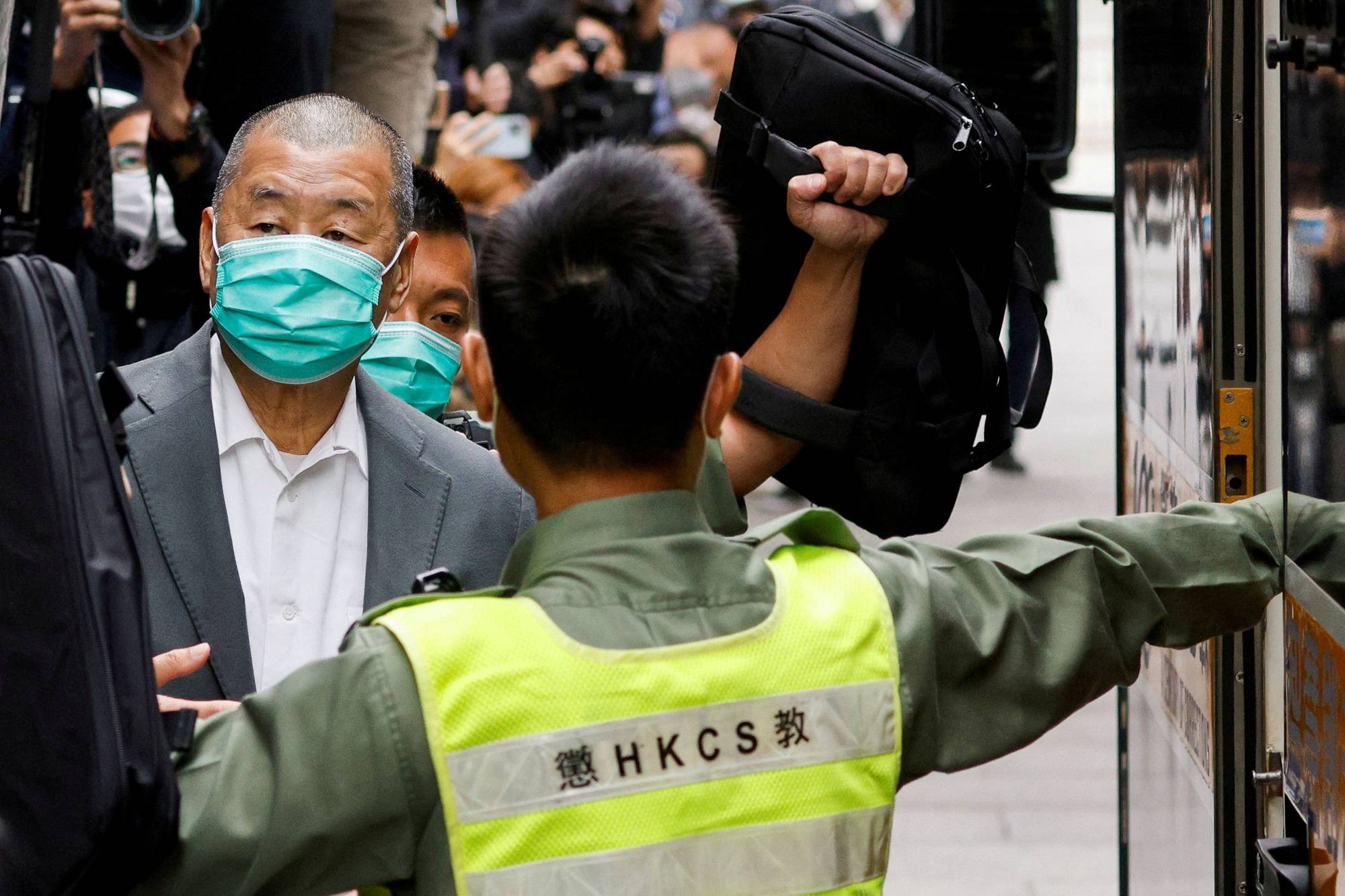 Media mogul Jimmy Lai, founder of Apple Daily, leaves a court in Hong Kong in February 2021.  | REUTERS