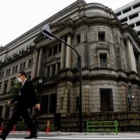 The Bank of Japan must guard against the risk of inflation well exceeding its expectations, says Takeo Hoshi, an academic with close ties to incumbent central bank policymakers. | REUTERS