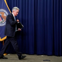 Powell departs after facing reporters at a news conference following a two-day meeting of the Federal Open Market Committee in Washington on June 15.  | REUTERS