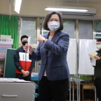 Taiwan President Tsai Ing-wen casts her vote during local elections in New Taipei City on Nov. 26. | CENTRAL NEWS AGENCY / POOL / VIA REUTERS