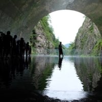 People line up to take photos in “Tunnel of Light,” by Mad Architects, at the Echigo-Tsumari Art Triennale. | ANDREA JUNG-AN LIU
