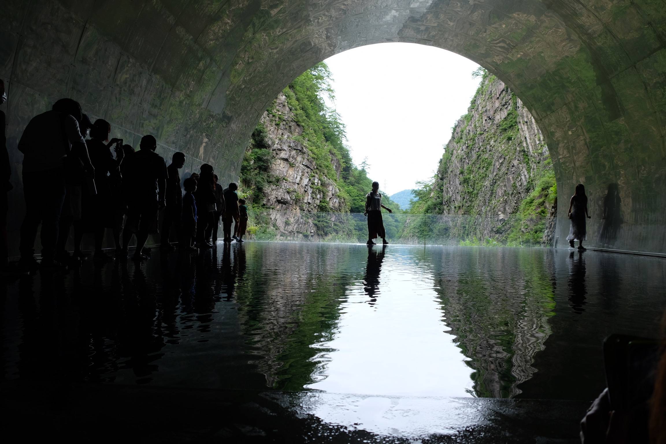People line up to take photos in 'Tunnel of Light,' by Mad Architects, at the Echigo-Tsumari Art Triennale. | ANDREA JUNG-AN LIU 