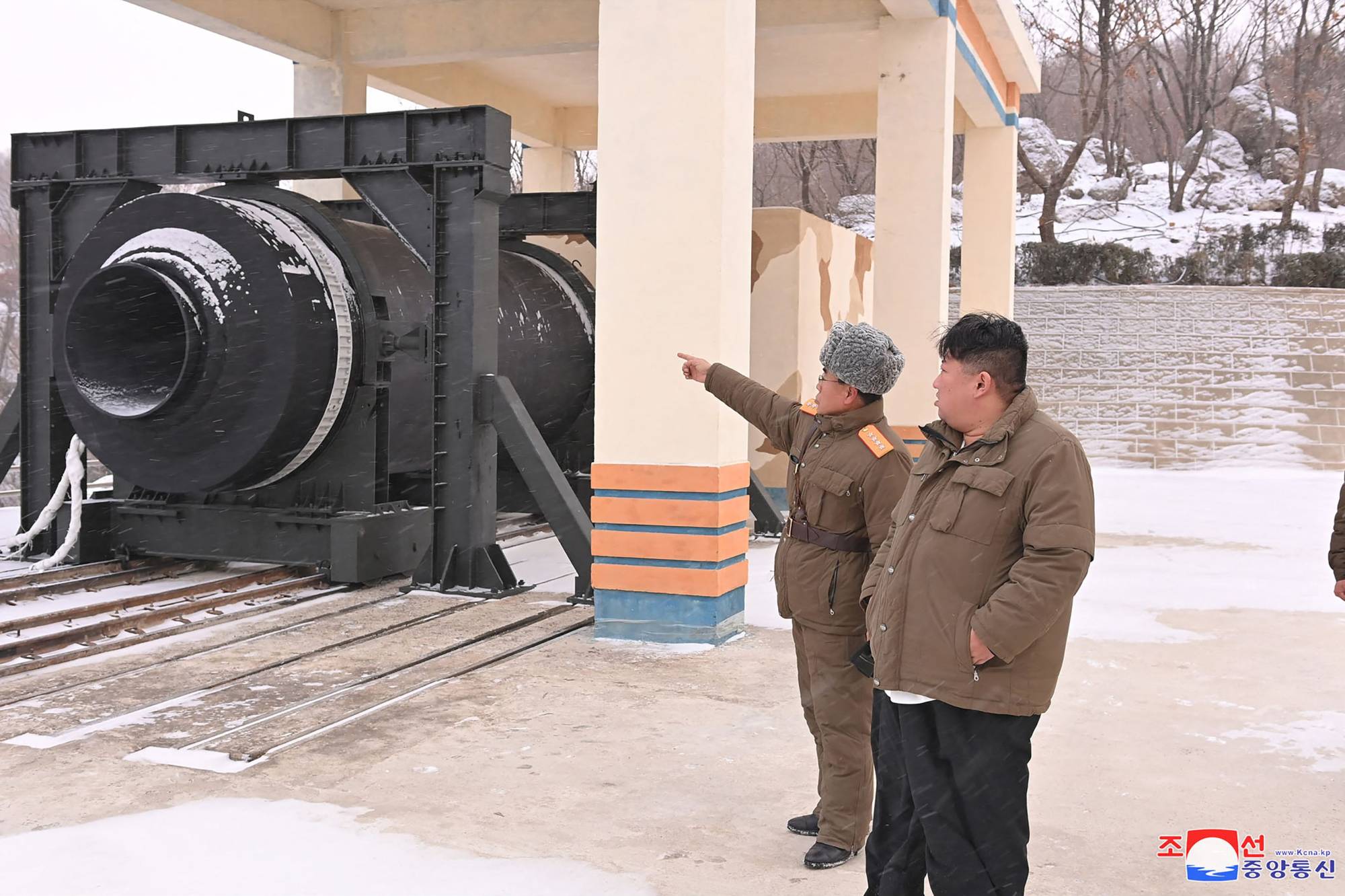 North Korean leader Kim Jong Un attends the test of a new solid-fuel missile engine at the Sohae Satellite Launching Ground in North Korea in this photo released Friday. |  KCNA / KNS / VIA AFP-JIJI