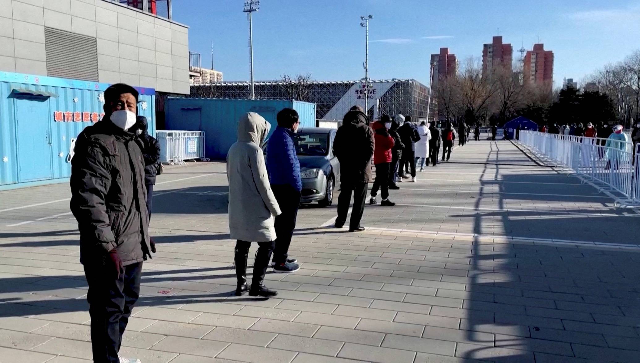 Residents line up to receive a nasal spray COVID-19 booster vaccine in Beijing on Saturday. | Reuters 