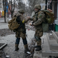 Ukrainian soldiers in Bakhmut, Ukraine, on Sunday. Ukrainian President Volodymyr Zelenskyy said the nation\'s armed forces were holding firm in the town. | TYLER HICKS / THE NEW YORK TIMES