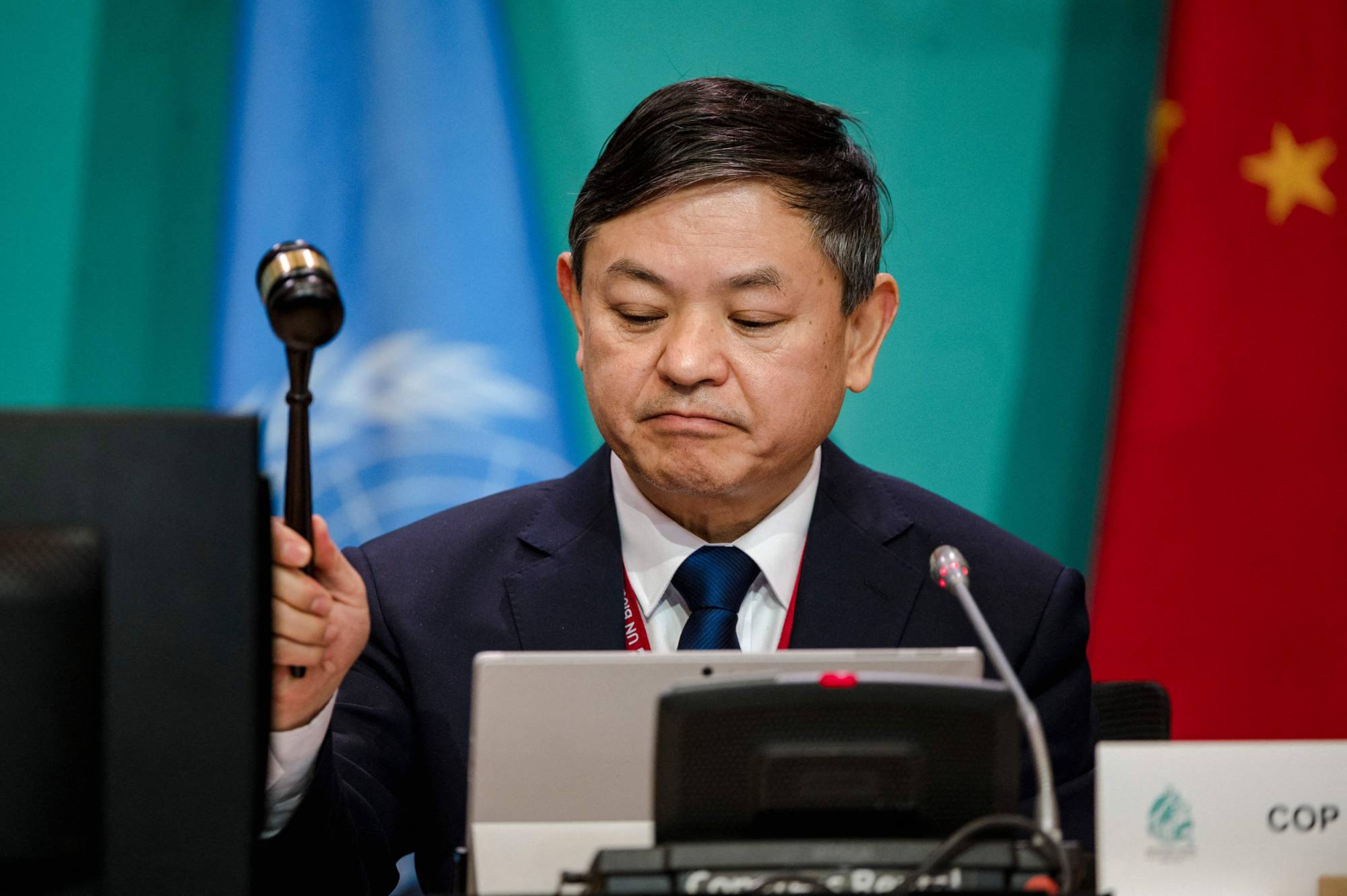 Chinese Ecology and Environment Minister Huang Runqiu opens the plenary session for the tail end of the COP15 biodiversity conference in Montreal on Monday. | AFP-JIJI