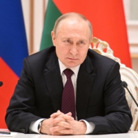 Russian President Vladimir Putin speaks during a visit to Minsk, Belarus, on Monday. | SPUTNIK / KREMLIN / VIA REUTERS