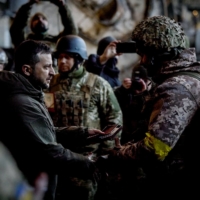 Ukrainian President Volodymyr Zelenskyy hands out the State Award to a soldier during a ceremony in the eastern front-line city of Bakhmut, now the epicenter of fighting in Russia\'s nearly 10-month invasion of Ukraine.  | UKRAINE PRESIDENCY / VIA AFP-JIJI