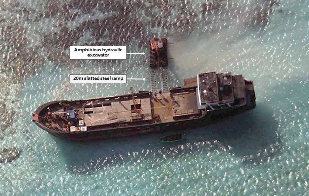 A Chinese maritime militia vessel is pictured offloading an excavator at Eldad Reef in 2014 in this satellite image. | BLOOMBERG 