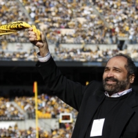 Former Steelers running back Franco Harris twirls a Terrible Towel before the start of the team\'s game against the Bengals on Dec. 23, 2012. | REUTERS