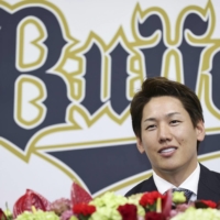 Masataka Yoshida speaks during a news conference at the Buffaloes\' facility in Osaka on Thursday. | KYODO
