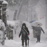 A snow-covered street in Kanazawa, Ishikawa Prefecture, on Friday morning | KYODO