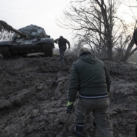 Ukrainian soldiers on their way to fight Russian forces in Kreminna, in eastern Ukraine, on Sunday. Recapturing Kreminna would be a step further in Ukraine’s campaign to retake major cities that Russia seized after it invaded. 
 | TYLER HICKS / THE NEW YORK TIMES