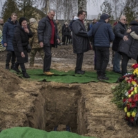 A funeral for Sgt. Oleksiy Bondarev, a Ukrainian soldier who died fighting in the Donetsk region, in Bucha, Ukraine, on Tuesday | LAURA BOUSHNAK / THE NEW YORK TIMES