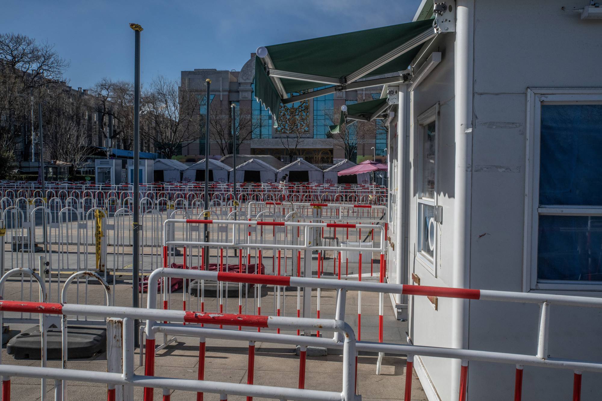Empty COVID-19 testing booths in Beijing on Dec. 17 | Gilles Sabrie / The New York Times