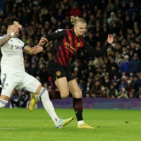 Manchester City\'s Erling Haaland (right) scores against Leeds during their match in Leeds, England, on Wednesday. | REUTERS