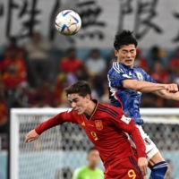 Japan\'s Shogo Taniguchi (right) and Spains Gavi vie for the ball during their match at the 2022 FIFA World Cup in Doha on Dec. 1. | AFP-JIJI