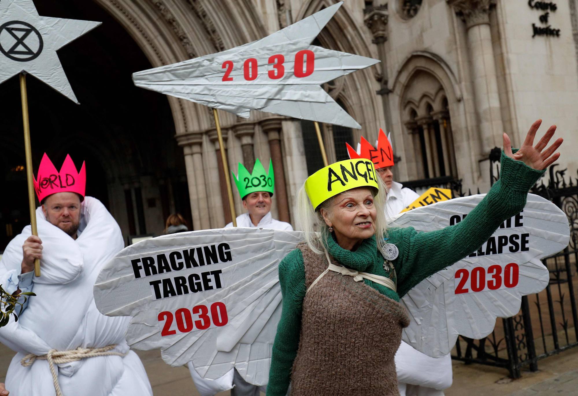 Vivienne Westwood poses with other anti-fracking activists at a demo outside the Royal Courts of Justice, Britain's High Court, in 2018. | AFP-JIJI