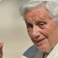 Pope Benedict XVI waves from the altar on Feb. 27, 2013, as he arrives on St. Peter\'s Square for his last weekly audience at the Vatican.  | AFP-JIJI