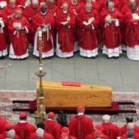 Pope Benedict XVI, then Cardinal Joseph Ratzinger, blesses the coffin of Pope John Paul II on April 8, 2005, during his funeral mass on St. Peter\'s Square at the Vatican City. | AFP-JIJI