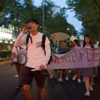 Fridays for Future leader Takuro Kajiwara heads a march through Tokyo\'s Omotesando neighborhood. | OSCAR BOYD