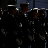 Maritime Self-Defense Force sailors salute Defense Minister Yasukazu Hamada (not pictured) aboard the MSDF\'s Izumo helicopter carrier during an International Fleet Review to commemorate the 70th anniversary of the navy\'s foundation, in Yokosuka, Kanagawa Prefecture, on Nov. 6. | POOL / VIA REUTERS