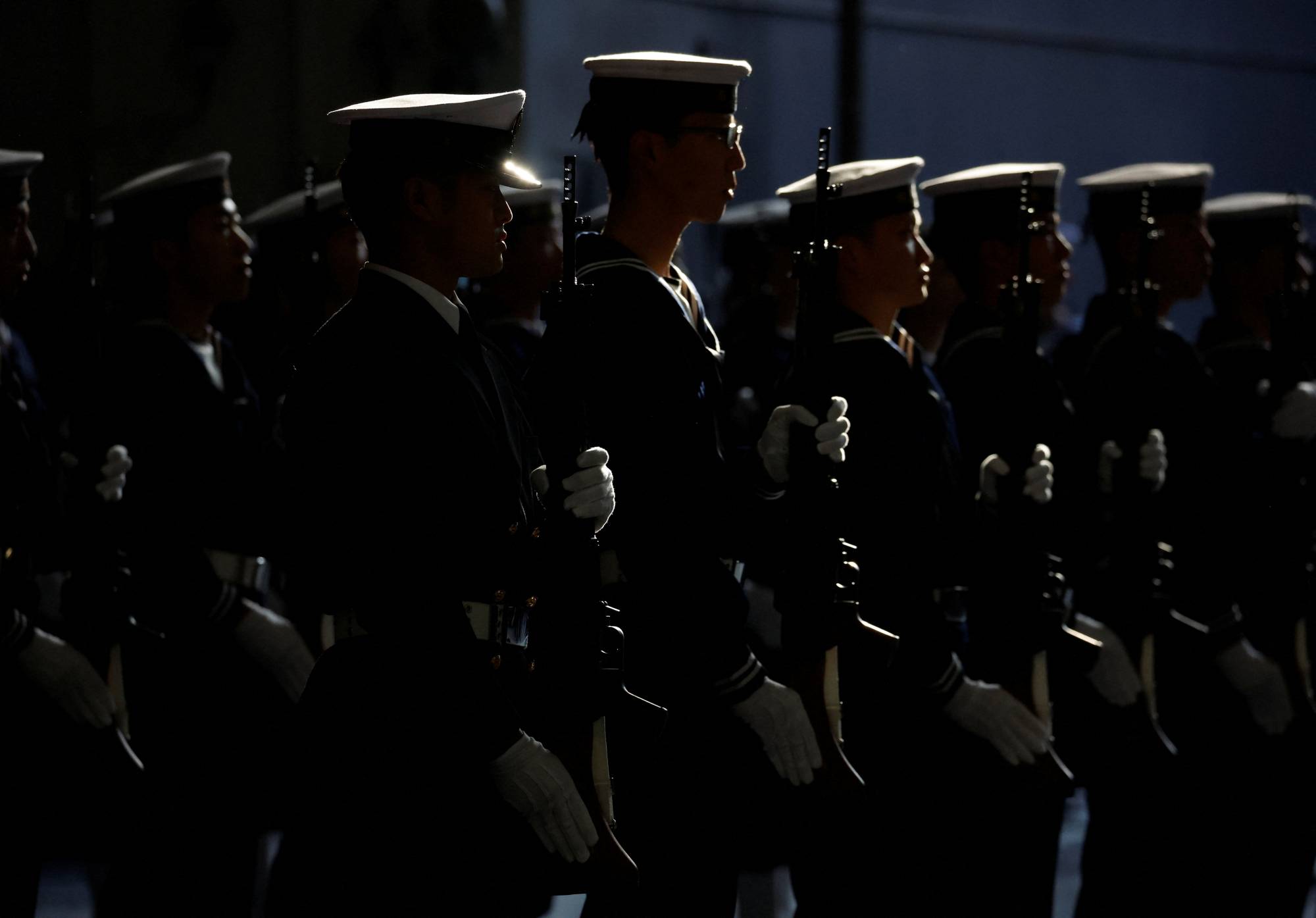 Maritime Self-Defense Force sailors salute Defense Minister Yasukazu Hamada (not pictured) aboard the MSDF's Izumo helicopter carrier during an International Fleet Review to commemorate the 70th anniversary of the navy's foundation, in Yokosuka, Kanagawa Prefecture, on Nov. 6. | POOL / VIA REUTERS