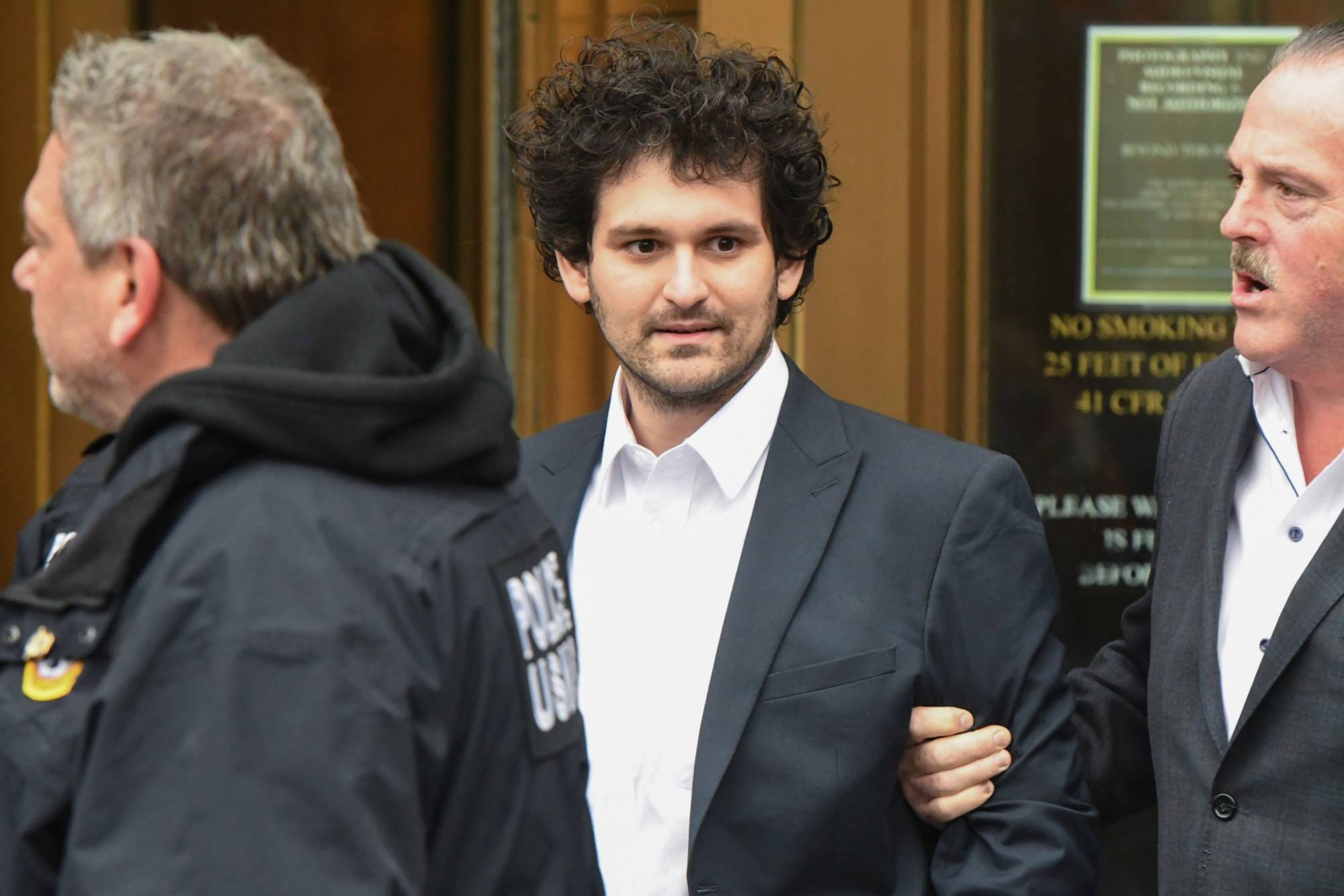 Bankman-Fried departs from court in New York on Dec. 22. | Bloomberg