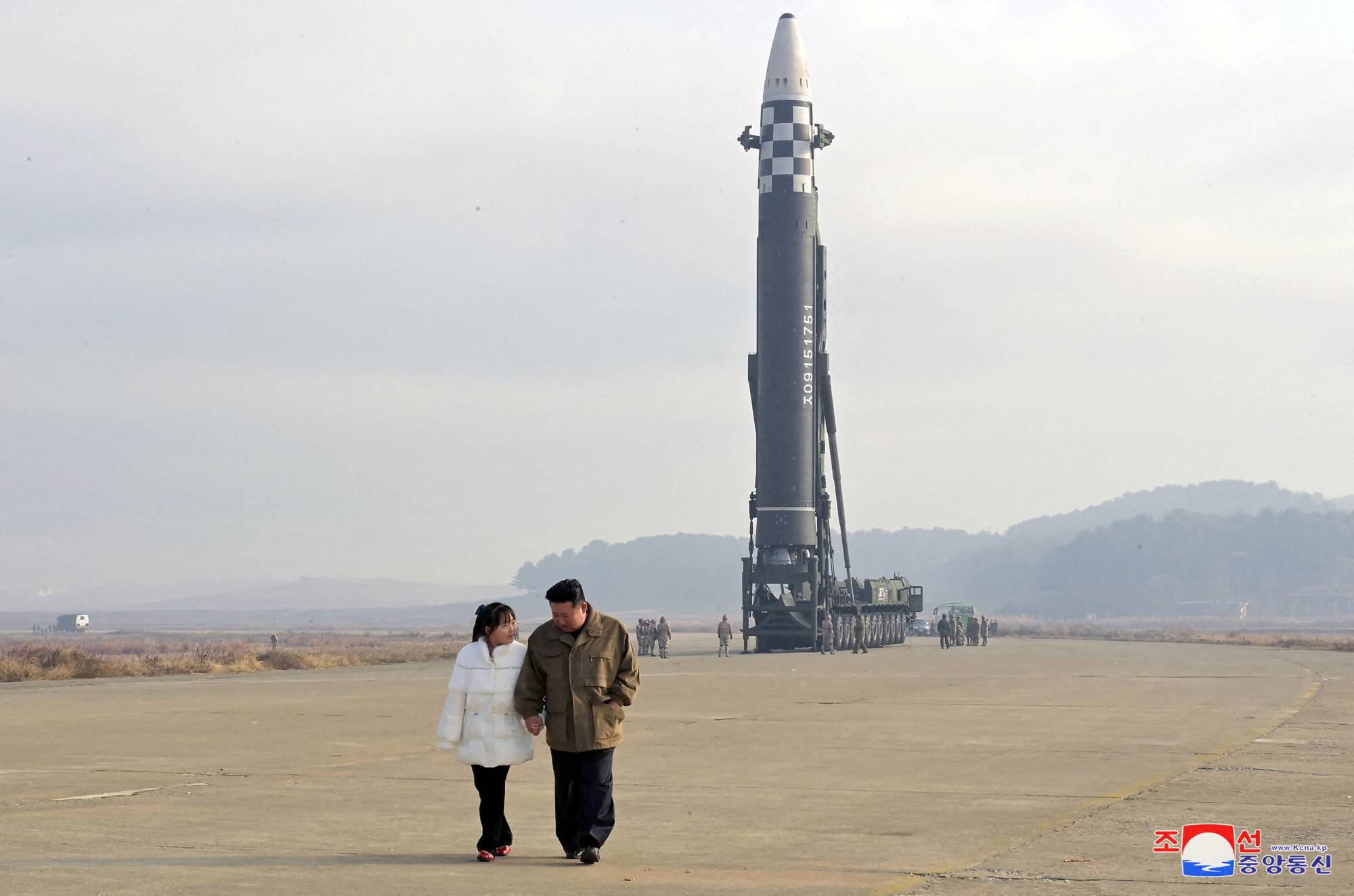 North Korean leader Kim Jong Un and his daughter walk near an intercontinental ballistic missile on Nov. 19. | KCNA / VIA REUTERS
