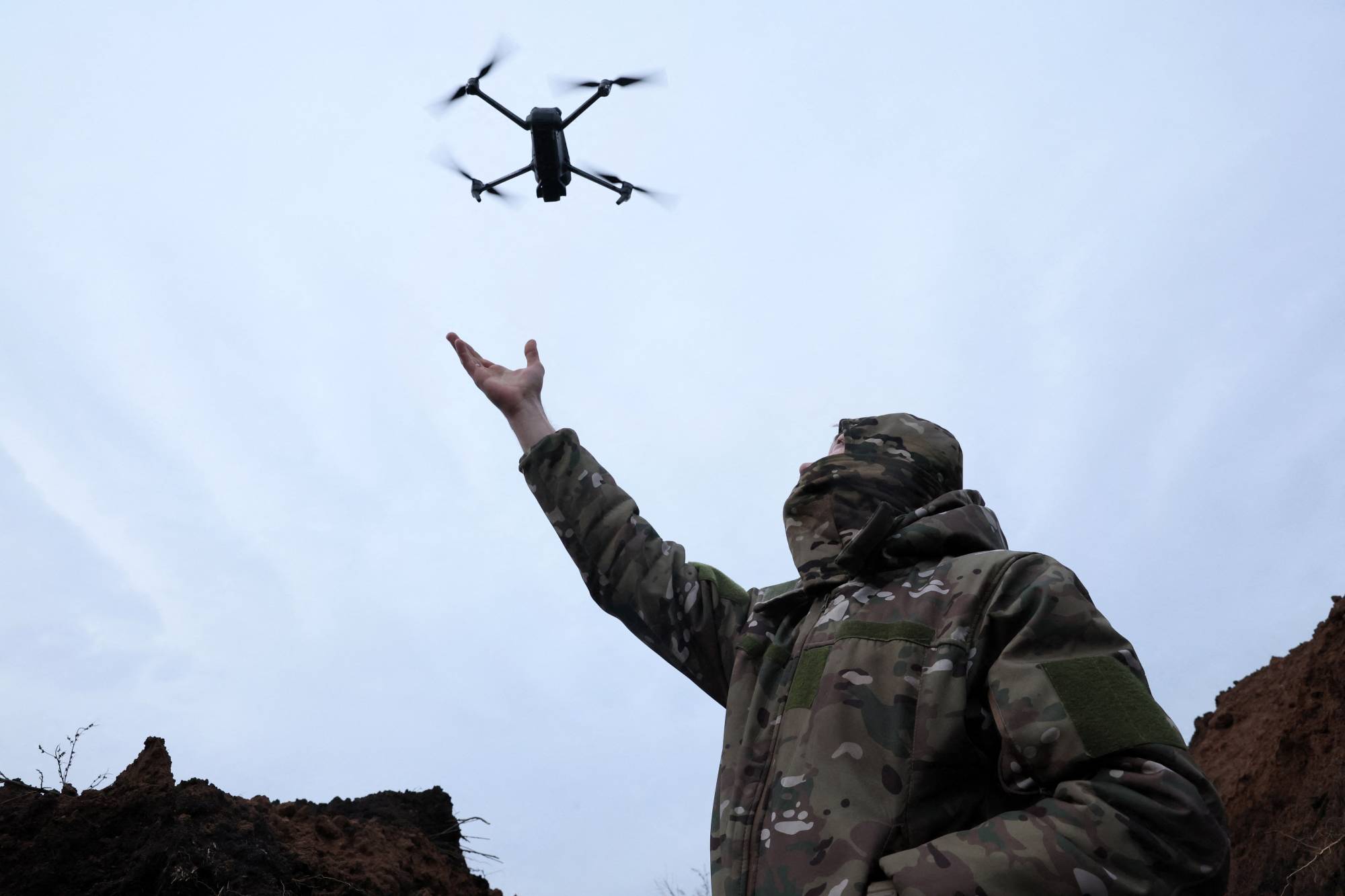 A Ukrainian Army soldier tests a drone near Bakhmut, Ukraine, on Nov. 25. Embracing cutting-edge technology throughout their military is becoming key for countries facing conflict. | REUTERS