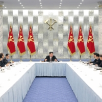 North Korean leader Kim Jong Un attends the 12th Politburo meeting of the eighth term of the Workers Party of Korea at the Party Central Committee in Pyongyang on Friday. | KCNA / KNS / VIA AFP-JIJI