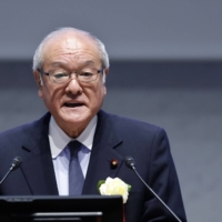 Finance Minister Shunichi Suzuki speaks during a meeting with Keidanren business lobby in Tokyo on Dec. 26. | BLOOMBERG