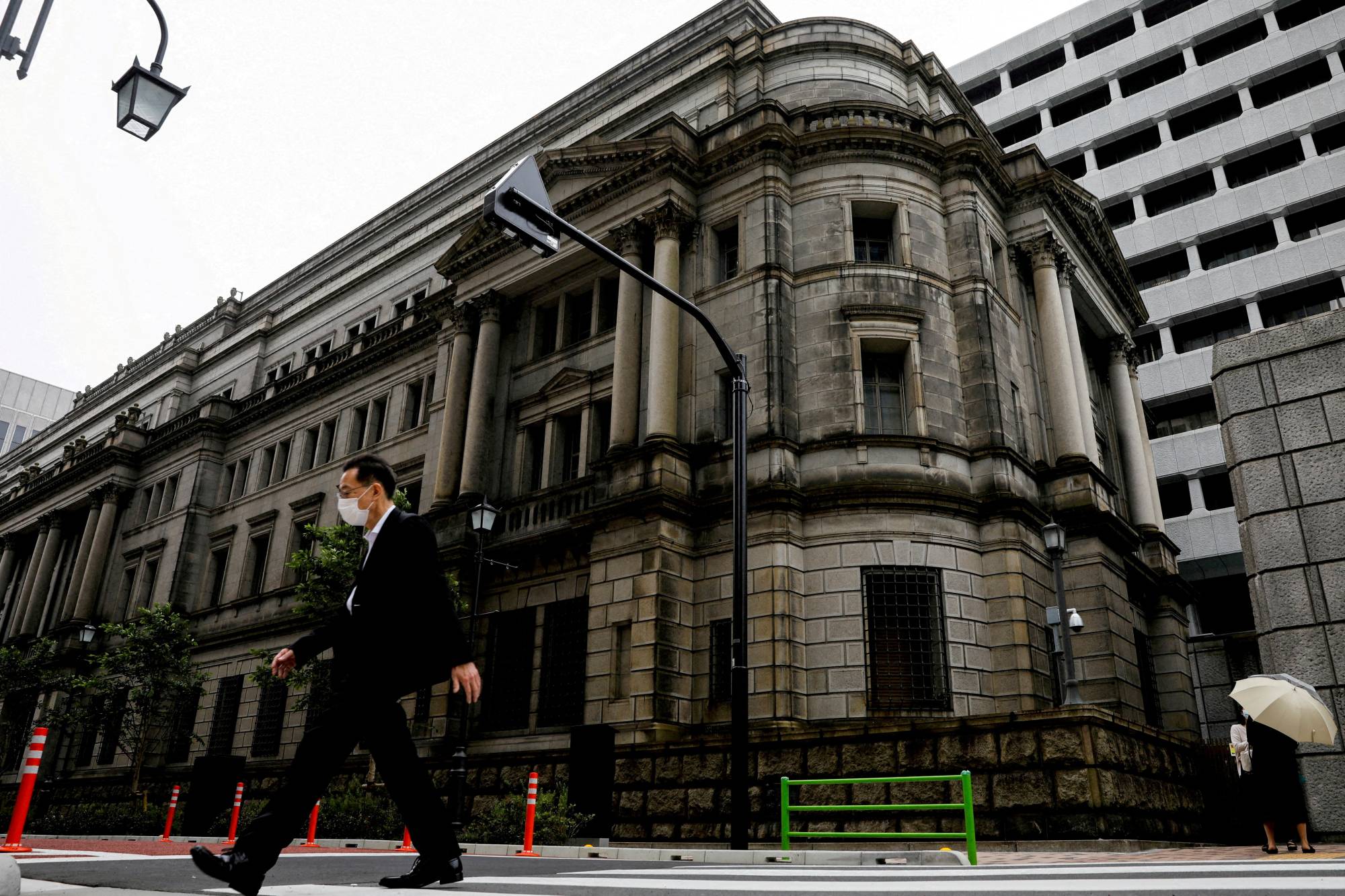 The Bank of Japan is considering revising its inflation forecasts upward in a move that could fuel market speculation that the BOJ is set to shift away from its aggressive monetary easing. | REUTERS