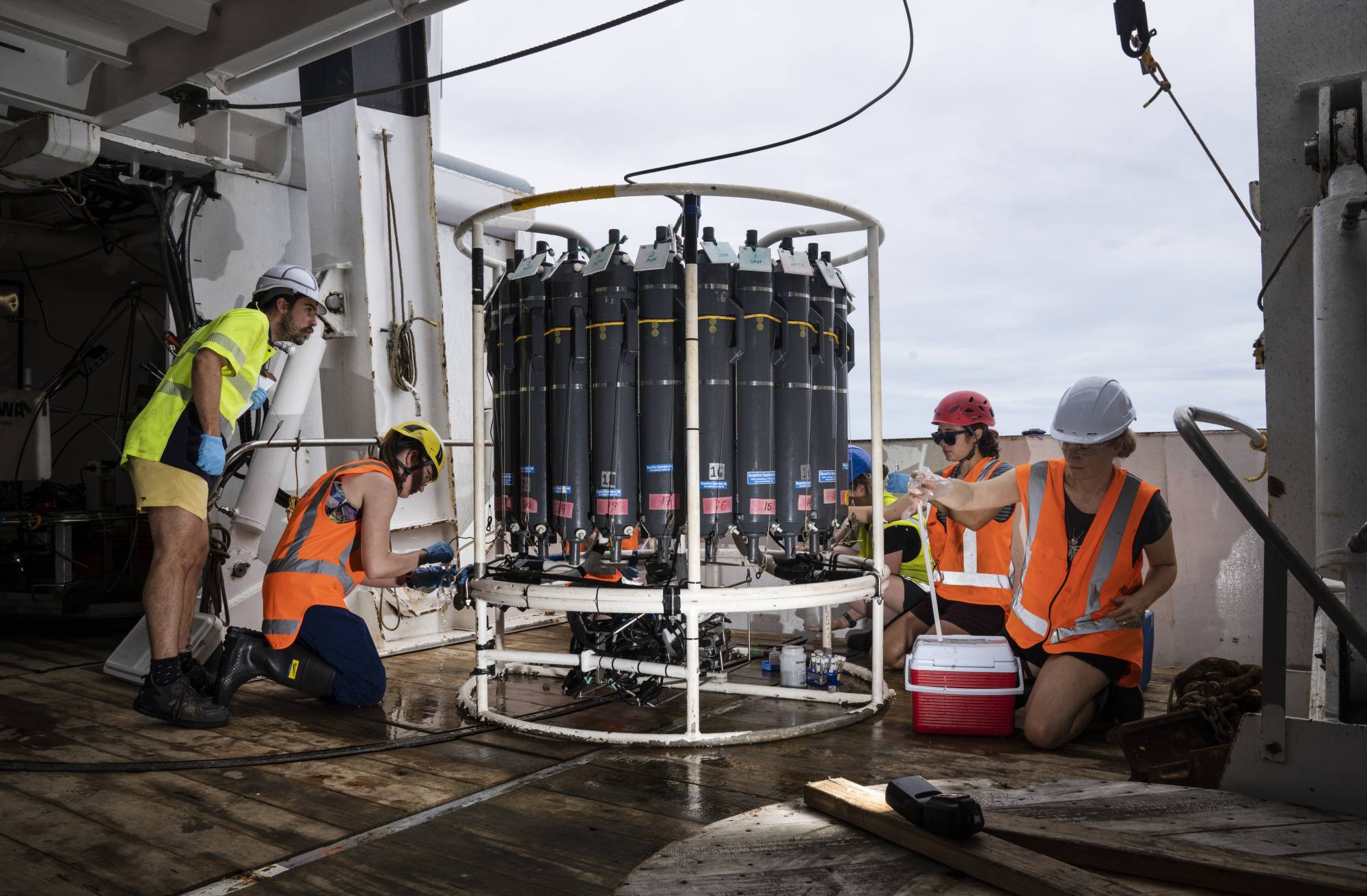 Researchers collect samples of water near the Hunga Tonga-Hunga Ha'apai volcano to analyze it for a range of composition materials, from oxygen to ash. | NATIONAL INSTITUTE OF WATER AND ATMOSPHERIC RESEARCH