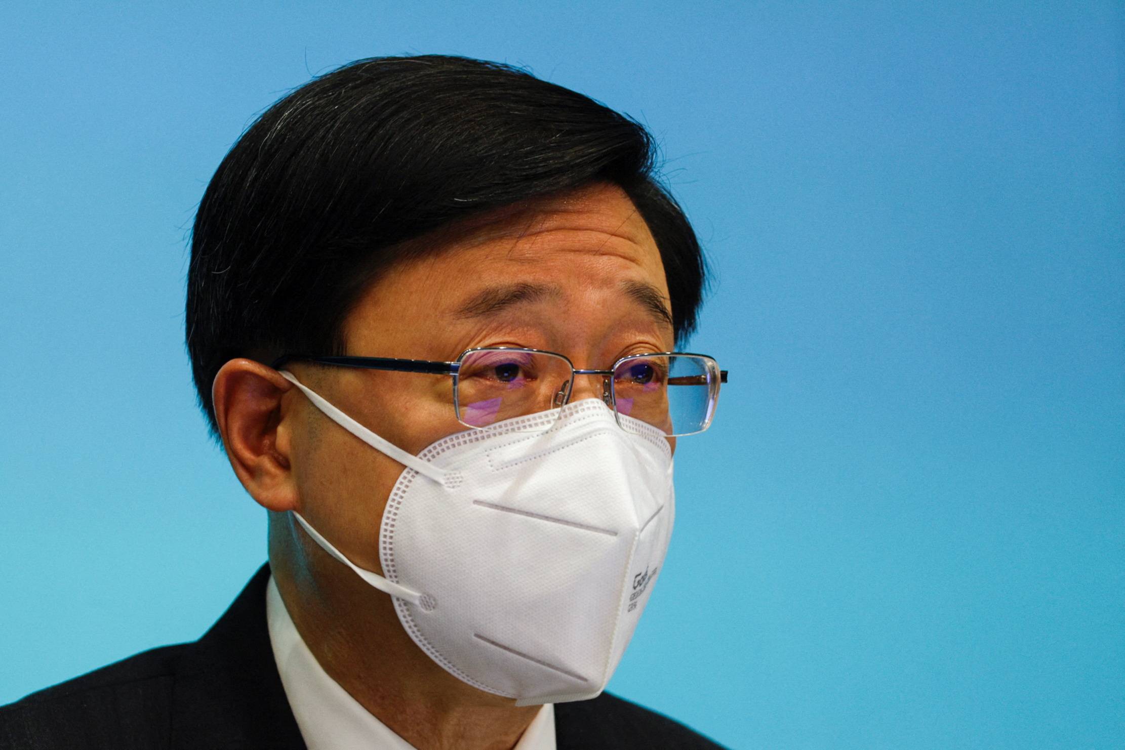 Chief Executive of Hong Kong John Lee gives a news conference over the shortened COVID-19 quarantine period in the city in August. | REUTERS
