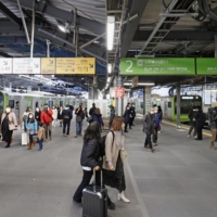 People walk through Shibuya Station, where a single platform was created for the so-called outer and inner loops of the Yamanote Line, on Monday. | KYODO