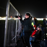 Spectators gather to watch the launch of Virgin Orbit\'s LauncherOne rocket from Spaceport Cornwall in Newquay, England, on Monday.  | REUTERS 