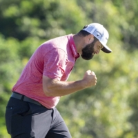 Jon Rahm celebrates after making his put on the 18th hole during the final round of the Sentry Tournament of Champions in Maui, Hawaii, on Sunday. | USA TODAY / VIA REUTERS