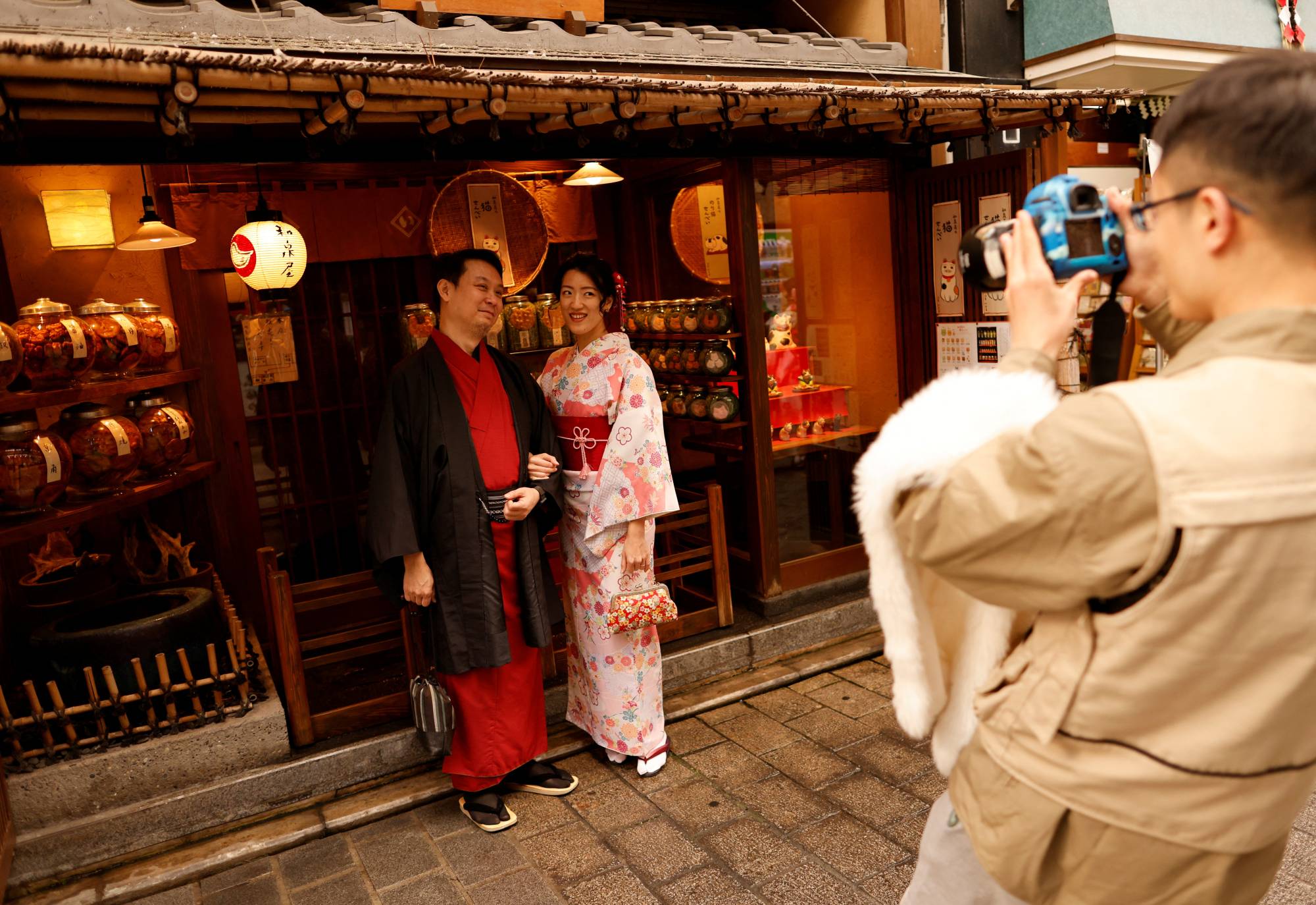 Tourists from Taiwan pose for a photograph in Tokyo's Asakusa district on Monday. | REUTERS