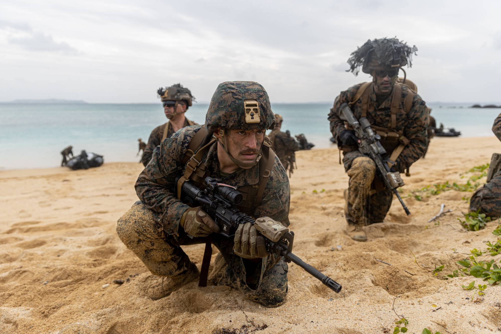U.S. Marines with the 31st Marine Expeditionary Unit provide security during a boat raid exercise at Camp Schwab, in Okinawa Prefecture, on Dec. 14. | U.S. MARINE CORPS.
